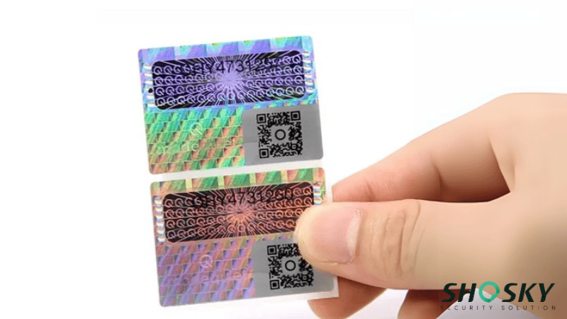 a 3d hologram sticker holding by someone