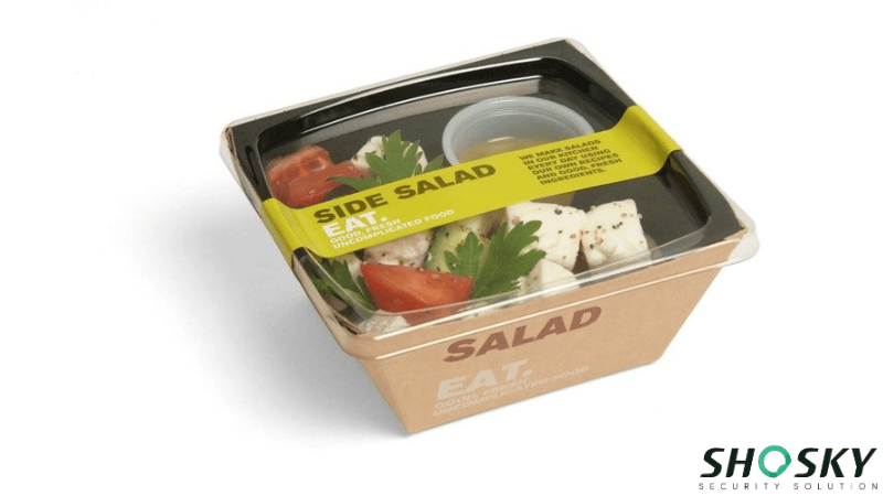 a take out box within salad sealed by security sticker