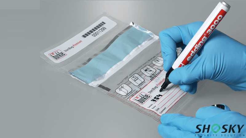 Healthcare worker labeling a tamper-evident bag