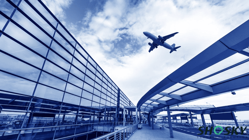 A plane flies over the airport