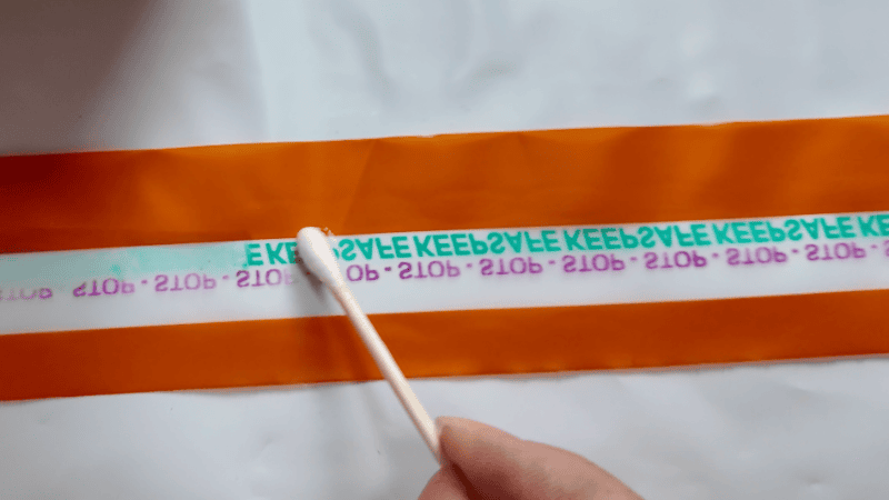 using chemical material to tamper the security bag tape