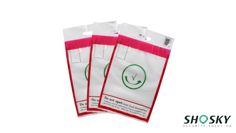 Sealed, Transparent Security Bags (STEBs) with green checkmark symbols