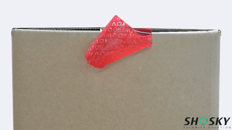 a red Non-Transfer Security Tape used on a box