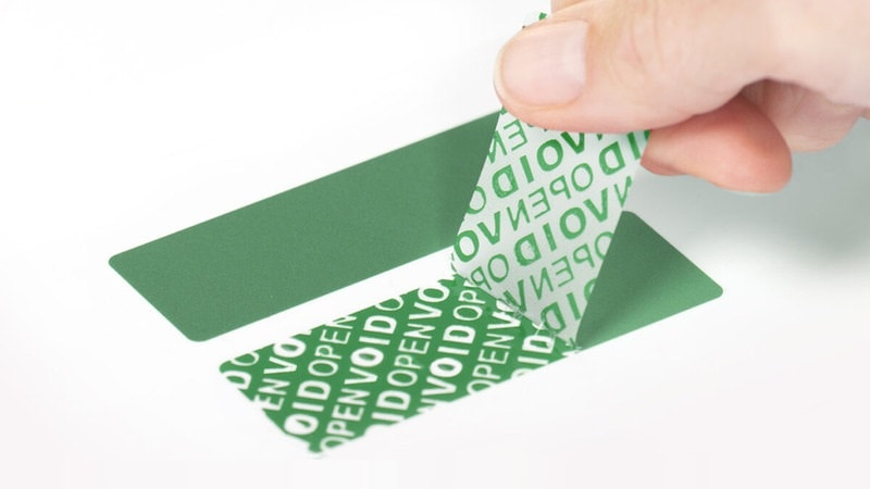 Paper adhesive label removed to reveal "VOID OPEN" text