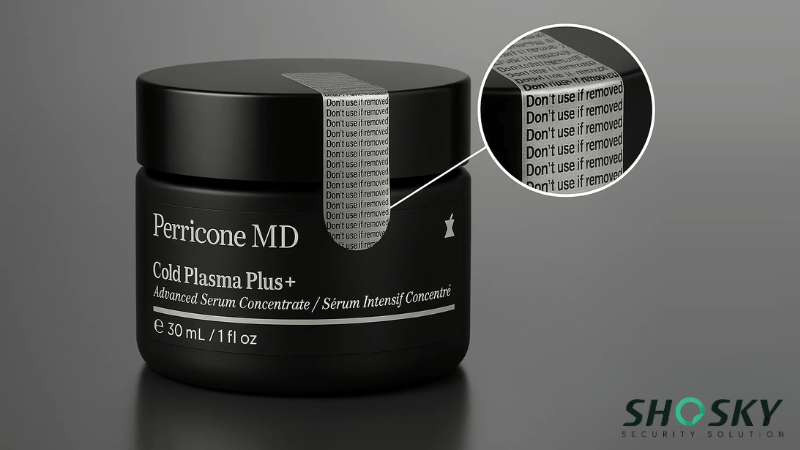 A serum jar with visible tamper-evident seal on its black lid