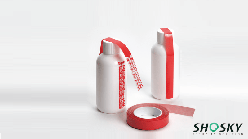 Roll of security tape placed with two bottles showcasing tamper-evidence features
