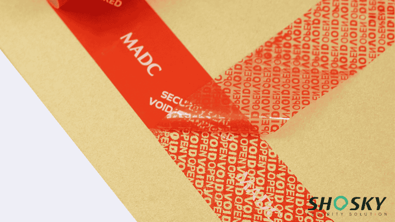 red tamper evident tape using on cardboard box packaging