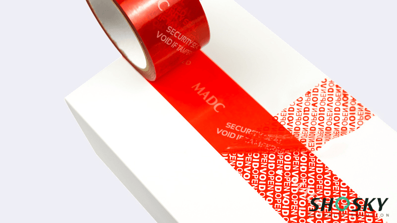red tamper evident tape using on a white box