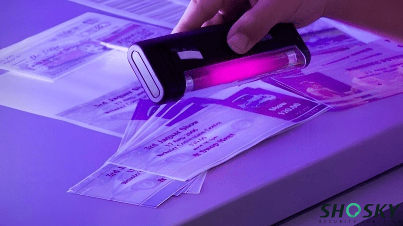 Ultraviolet detection device uncovering tamper-evident features for verification