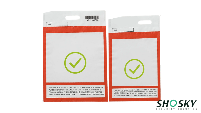  Two clear duty-free security bags with red borders, featuring green checkmark symbols and tamper-evident seals