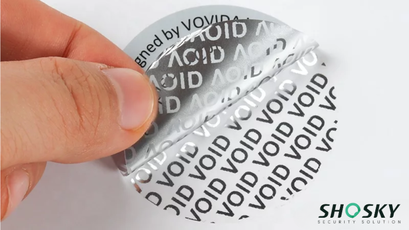 Tamper-evident warranty label revealing 'VOID' text upon removal