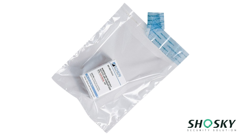 Tamper-evident security tape on a pharmaceutical package revealing “VOID” after breach