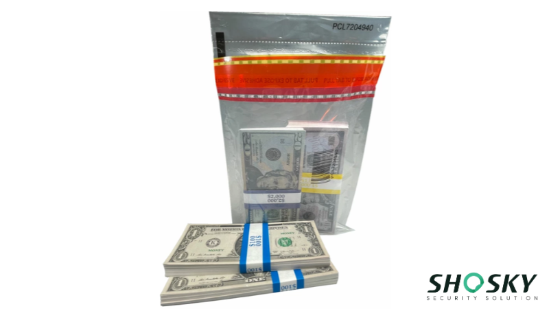 Currency bundles sorted outside and inside a transparent security bag marked for banking