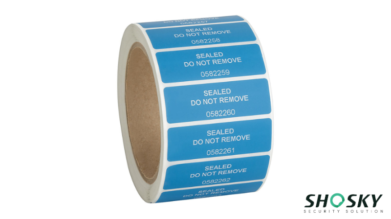 Roll of blue paper security labels with "SEALED DO NOT REMOVE" text