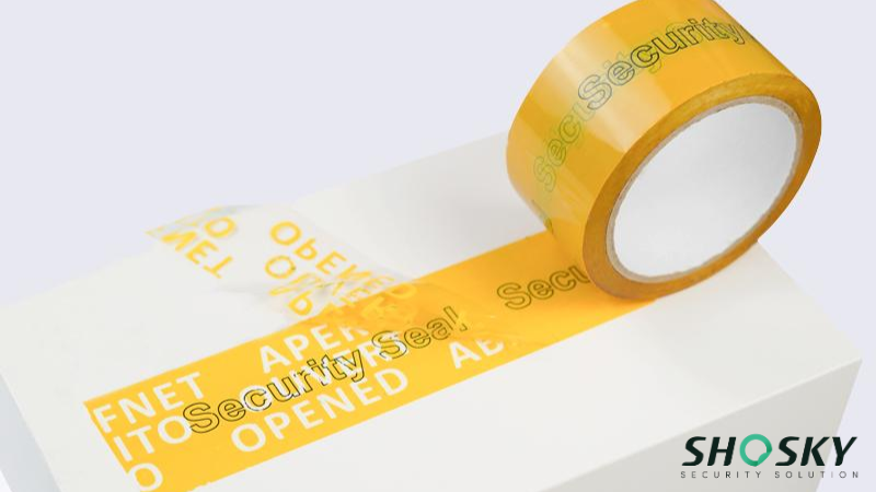 yellow packaging security tape applied to cardboard box for delivery and storage security 