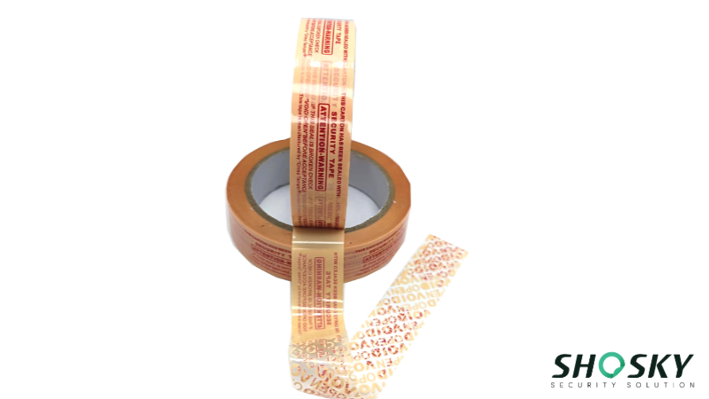 Partially unrolled tamper evident tape shows warnings for packaging breach detection