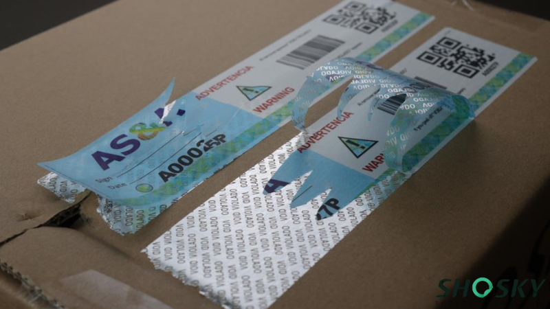 qr code label using on a box packaging and being removed by someone