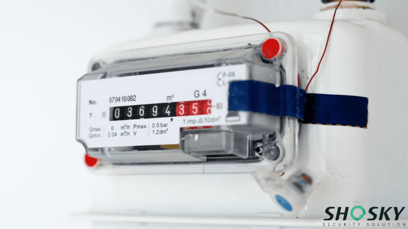 Tamper-evident meter seal and void stickers applied to a residential gas meter
