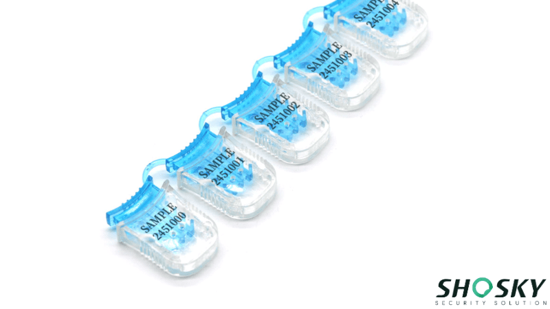 Custom numbered meter seal samples with transparent housing and blue tamper-evident inserts