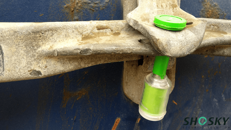 A Shosky's Green High Security Bolt Seal Used for Drum Trailers