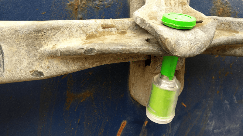 A Shosky's Green High Security Bolt Seal Used for Drum Trailers