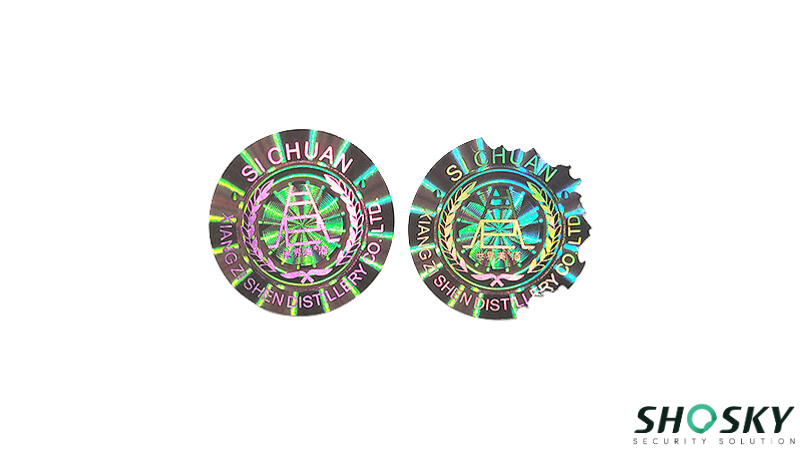 Custom round holographic security stickers showing fragile destructible effect when tampered