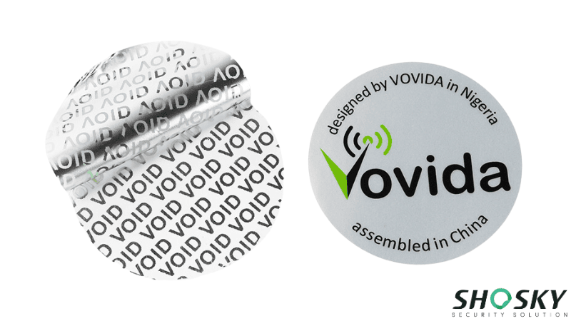 Round silver VOID security sticker showing tamper-evident residue upon removal