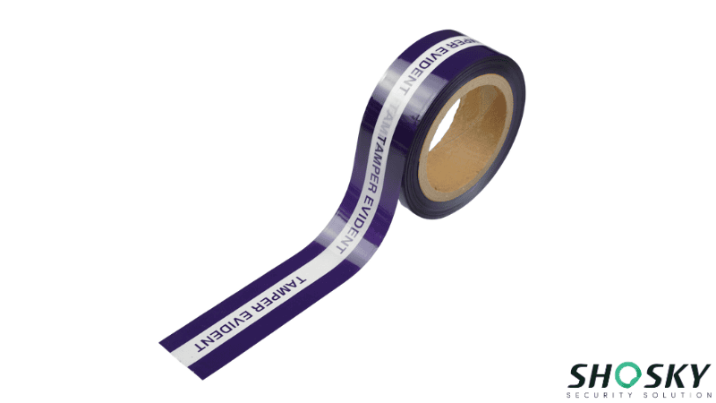 Roll of deep purple tamper-evident security tape showing repeated text reading "TAMPER EVIDENT"