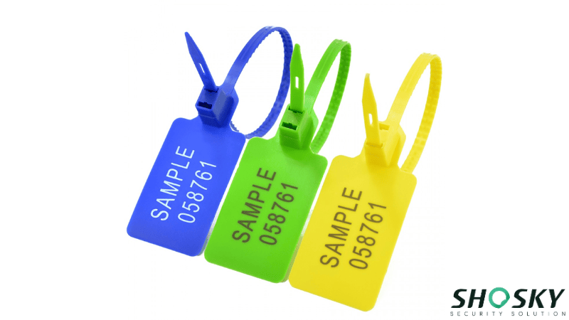 Blue, green, and yellow plastic security seals with printed serial numbers.