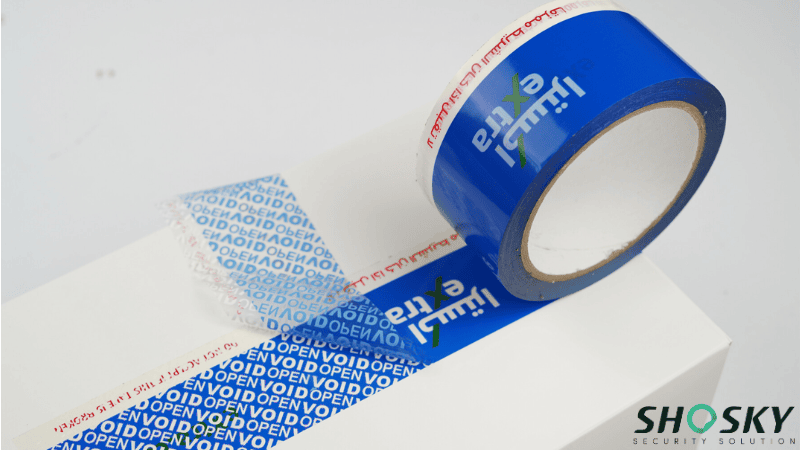 Custom branded blue security tape with Arabic script for hot weather being peeled back to reveal a hidden "VOID OPEN" message.
