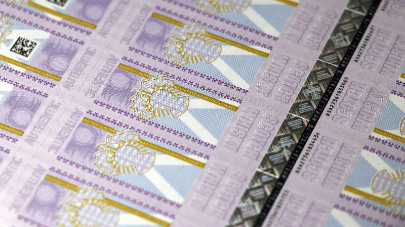 Close-up of a sheet of printed Excise Tax Stamps featuring intricate patterns, QR codes, and serial numbers for tax verification.