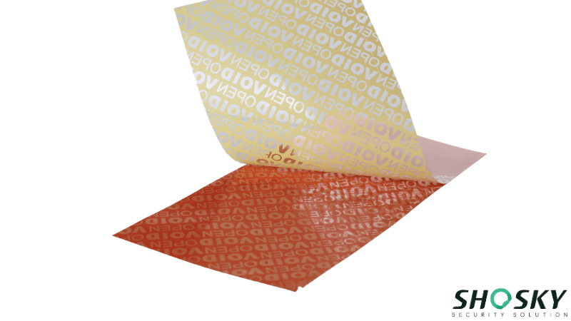 A full- transfer yellow tamper-evident material being peeled away and leaving behind a clear "VOID OPEN" security message