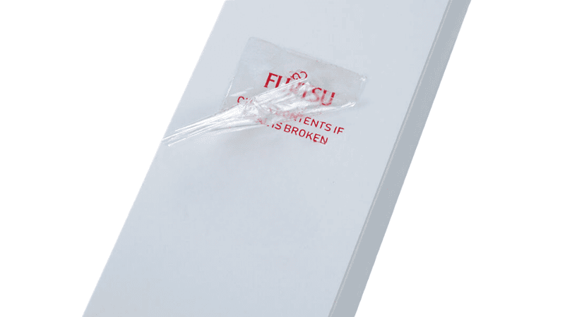 A clear tamper-evident seal peeled back from a white box to reveal red Fujitsu branding text left on the surface, ensuring cosmetics packaging security.