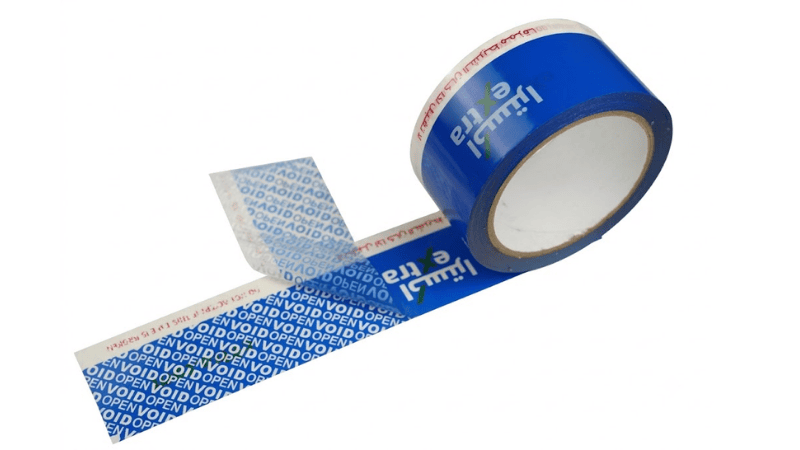A roll of blue extreme temperature tamper-evident tape unrolled and peeled back to display a clear blue "VOID OPEN" security pattern residue left on the surface.