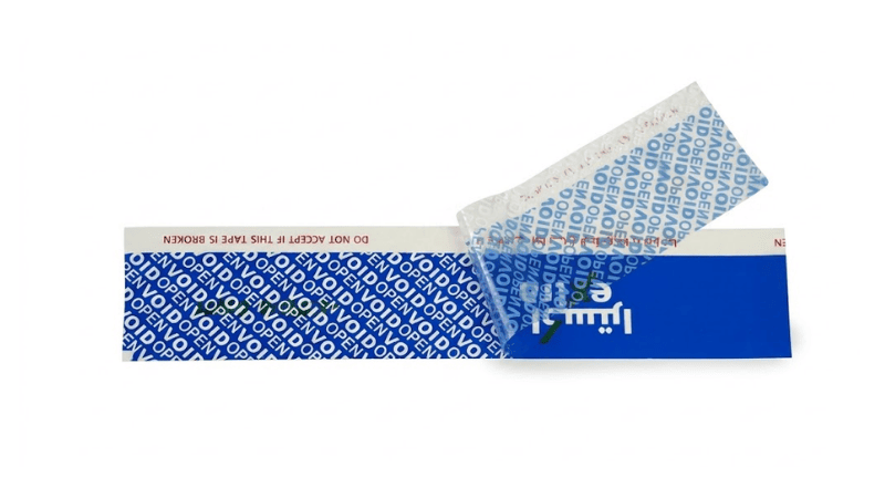 A strip of extreme temperature tamper-evident tape peeled back to reveal a prominent blue "VOID OPEN" security pattern underneath, demonstrating clear tamper evidence.