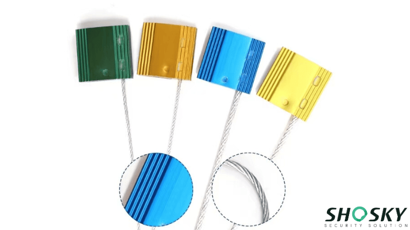 Four colorful aluminum body cable seal locks in green, orange, blue, and yellow, with close-ups showing the ridged body surface and steel wire construction.