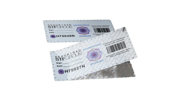 High-security VOID tamper-evident labels with holograms, serial numbers, barcodes, and peel-off tamper patterns isolated on a white background.